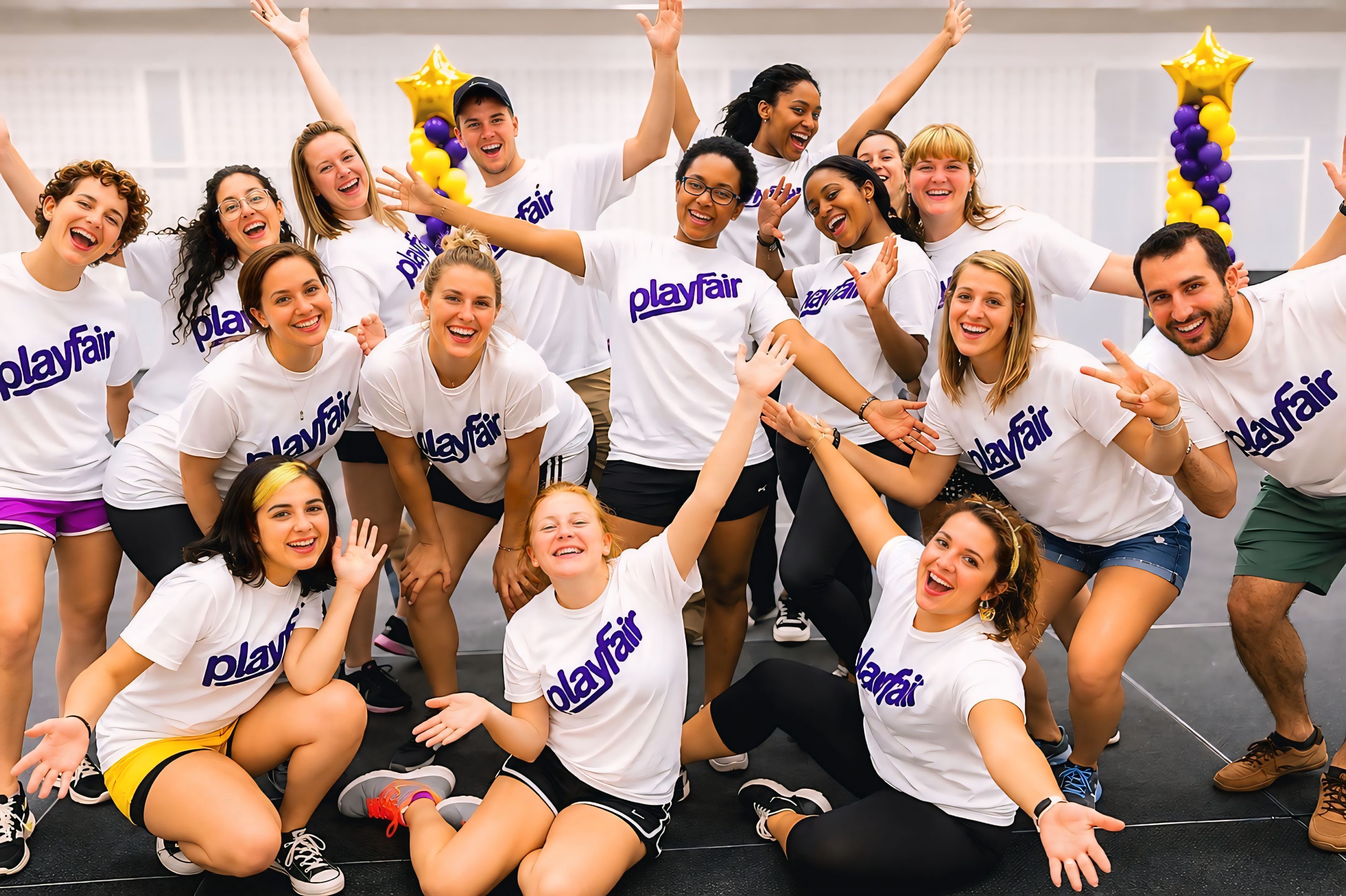The Playfair team in white Playfair shirts with the purple logo